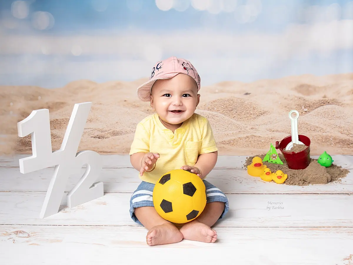 Six month baby photoshoot in Gurgaon smiling baby boy ball theme