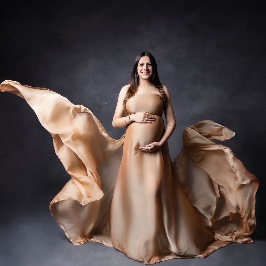 Flowing Fabrics Capturing Grace in Maternity Photography